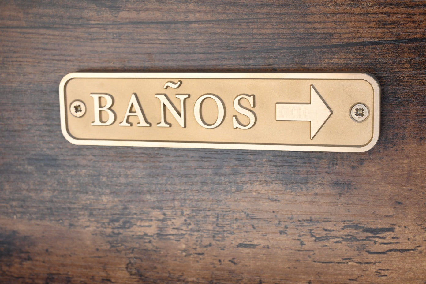 Placa Latón Baños izquierda